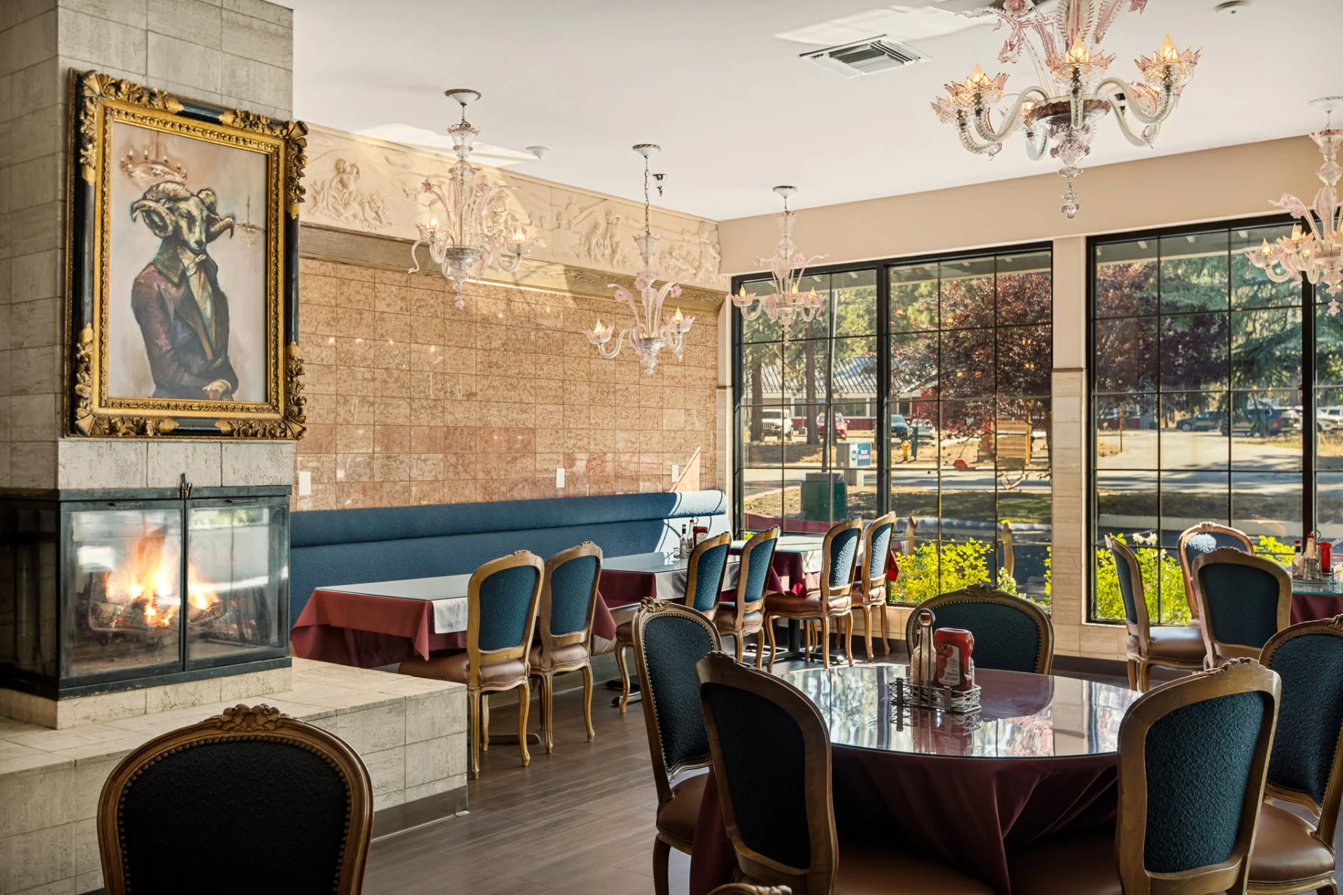 breakfast dining room with large windows and fireplace